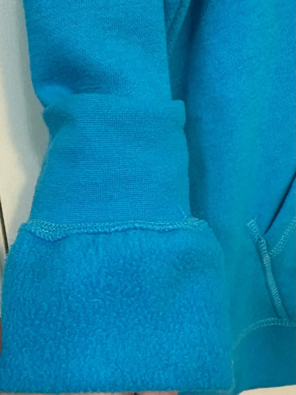 The North Face Turquoise Pullover Hoodie with Cream Logo